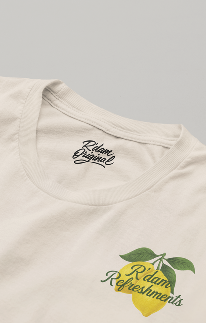 Crèmekleurig shirt met lemon print, coastal vibes & R’dam Original tekst – voorkant